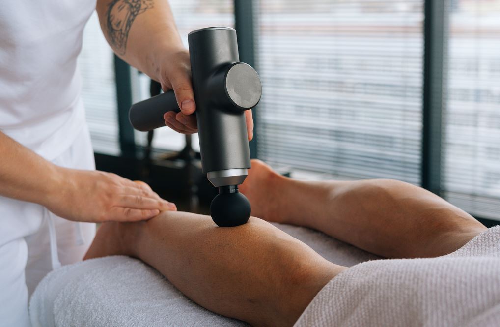 Pistolet De Massage Sur Jambes
