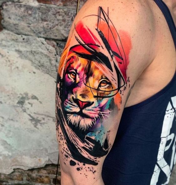Tatouage Tête De Lion Et Aquarelle Multicolore Sur Le Bras