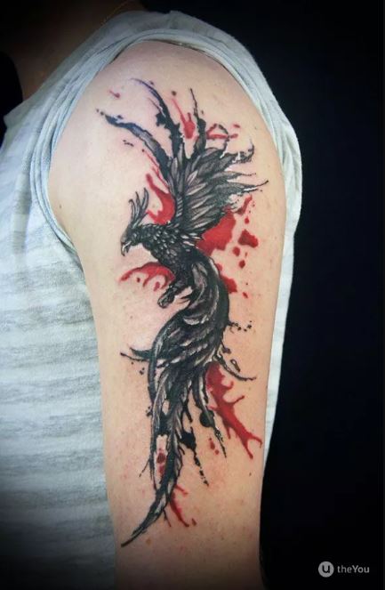 Tatouage Phoenix Noir Avec Peinture Aquarelle Sur Le Bras ©theyou