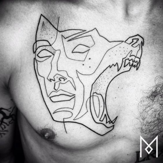 Tatouage Loup & Visage Sur Le Torse