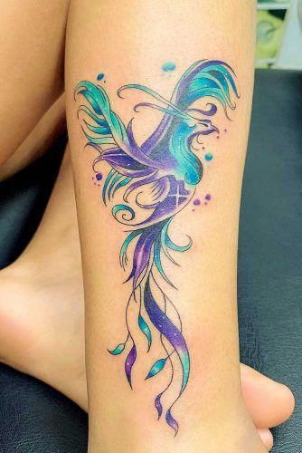Tatouage Phœnix étoilé Bleu Et Violet Sur La Jambe