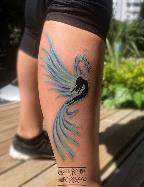 Tatouage Phœnix Avec Une Femme à L’intérieur Sur La Jambe