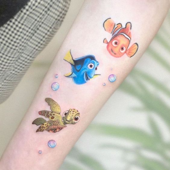 Tatouage Nemo, Dory Et Squizz Sur L'avant Bras