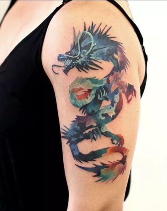 Tatouage Dragon Graphique Multicolore Sur Le Bras