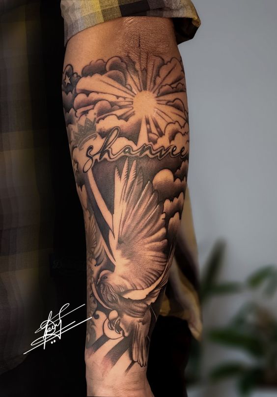 Tatouage Soleil, Nuages Et Colombe Sur L'avant Bras