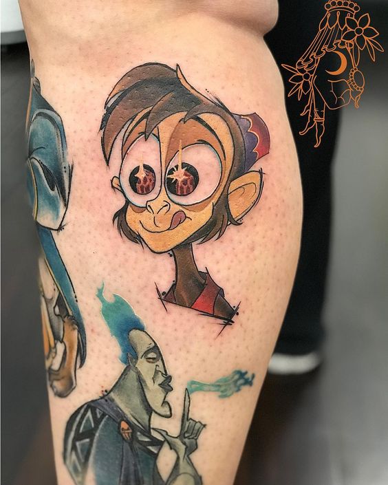 Tatouage Abu Et Hadès Sur La Jambe