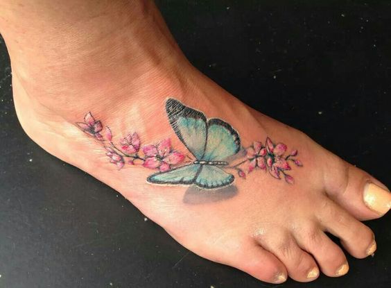 Tatouage Pied Avec Argus Bleu Et Fleurs De Cerisier