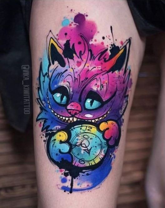 Tatouage Le Chat Du Cheshire En Aquarelle Sur La Cuisse