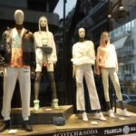 A Group Of Mannequins In A Window