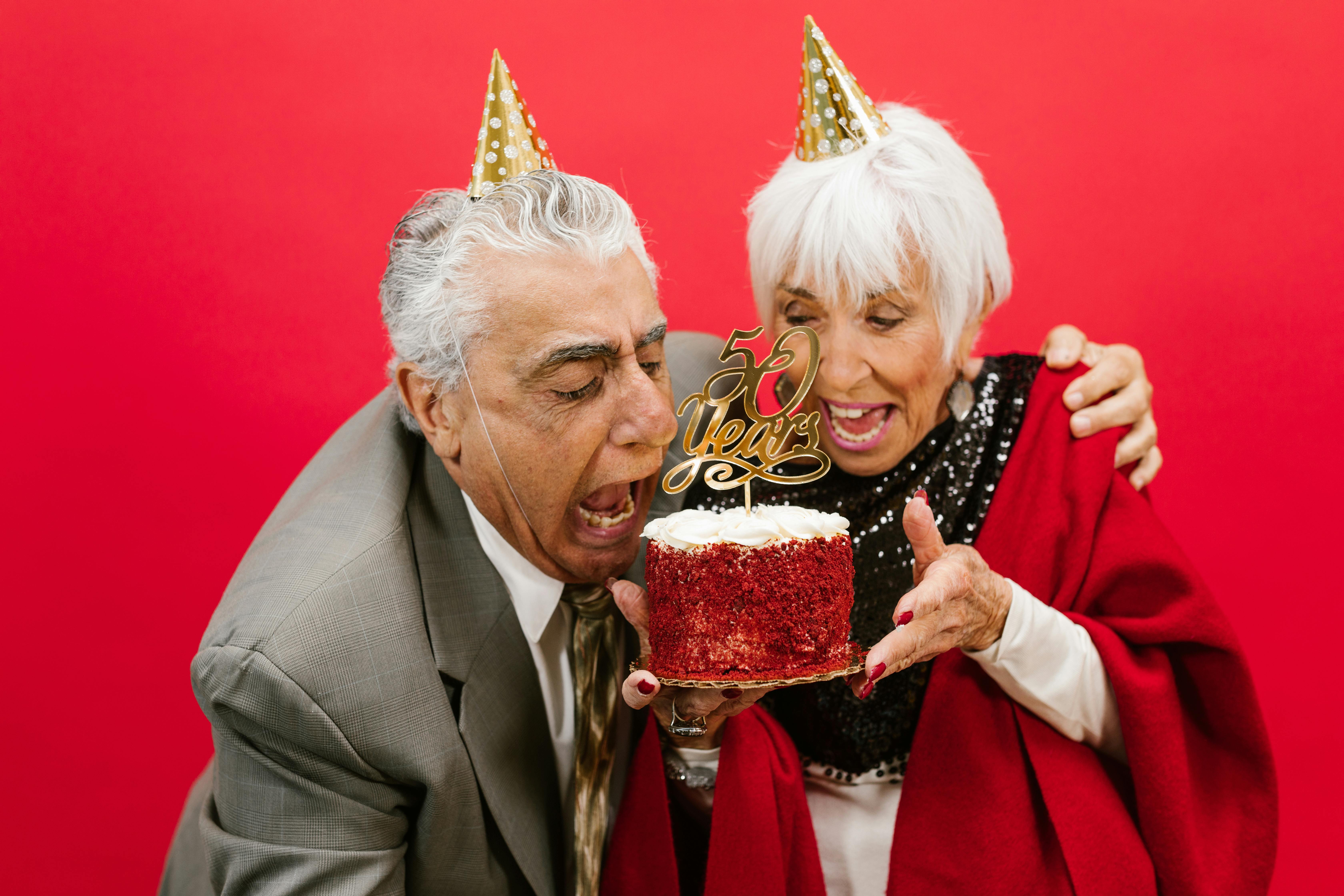 Cheerful Elderly Couple Celebrating Thei